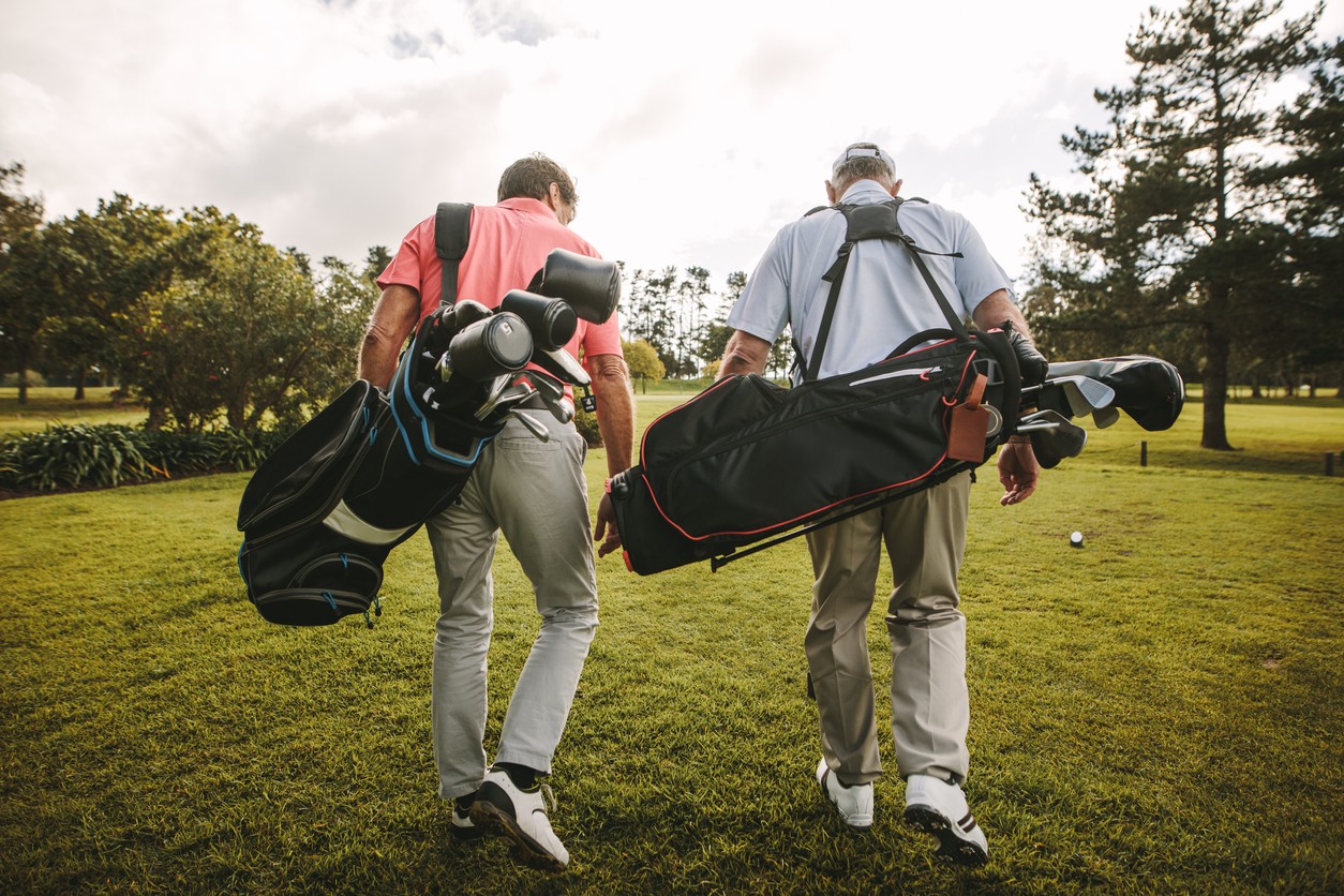 two-golfers-walking-the-course