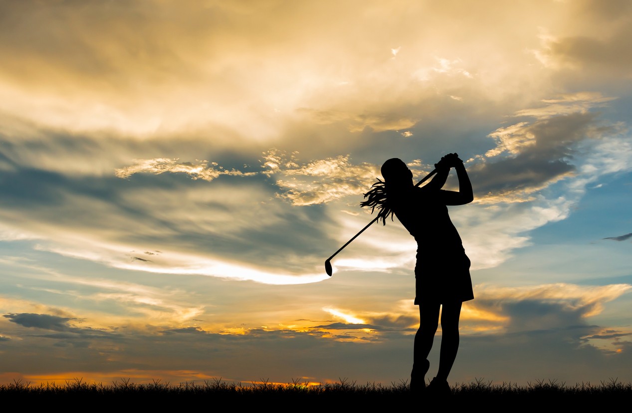 female-golfer-silhouette-at-sunset