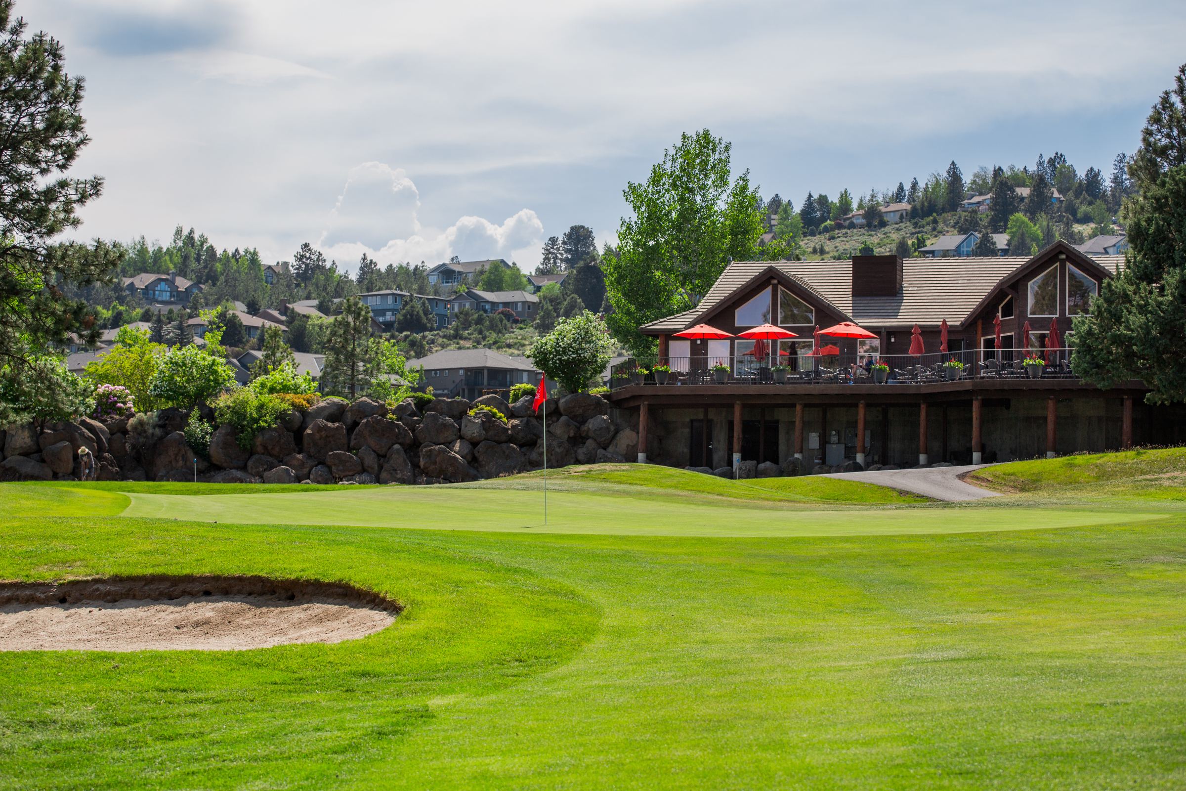 Main building on top of river's edge golf course hole.